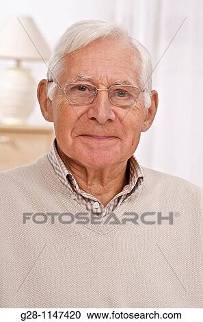 Portrait of smiling senior man with glasses View Large Photo Image Stock Image - Portrait of smiling senior man with glasses. Fotosearch