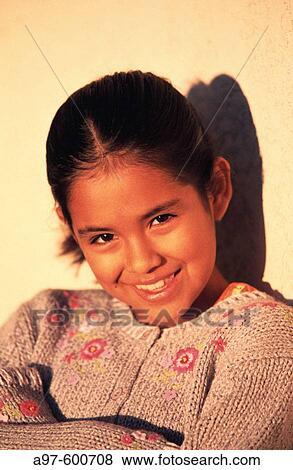 Stock Photo - Portrait of smiling young girl. Fotosearch