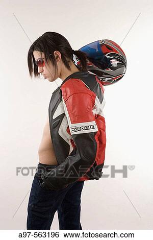 Portrait of teen boy with motorcycle jacket and helmet. White background. View Large Photo Image Stock Photograph - Portrait of teen boy with motorcycle jacket and helmet. White background.. Fotosearch