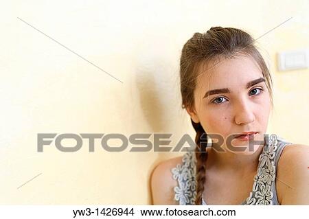 Portrait of teenage girl indoors with braid View Large Photo Image Picture - Portrait of teenage girl indoors with braid. Fotosearch