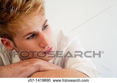 Stock Image - Portrait of thoughtful young man. Close view.. Fotosearch