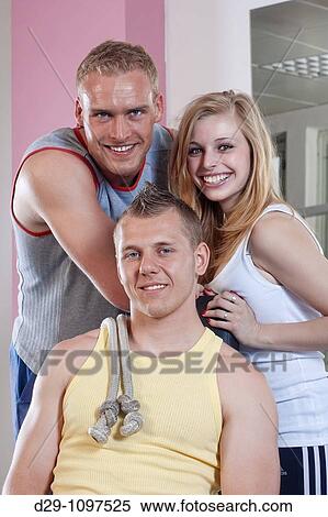 portrait of three fit young people in modern gym View Large Photo Image Stock Photography - portrait of three fit young people in modern gym. Fotosearch
