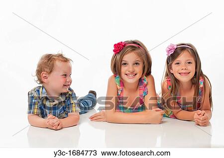 Stock Image - Portrait of three happy children. Fotosearch