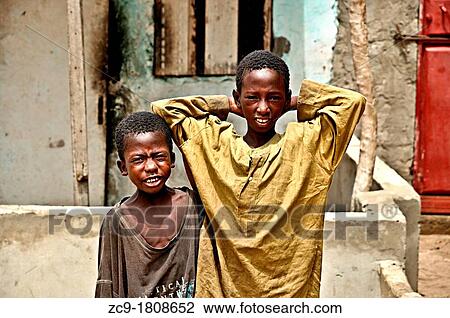 Portrait of two children in Saint Louis streets Saint Louis, Senegal View Large Photo Image Stock Image - Portrait of two children in Saint Louis streets Saint Louis, Senegal. Fotosearch