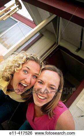 Portrait of two female college roommates. View Large Photo Image Stock Photograph - Portrait of two female college roommates.. Fotosearch