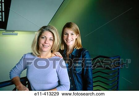 Portrait of two female office workers in stairwell View Large Photo Image Stock Photo - Portrait of two female office workers in stairwell. Fotosearch