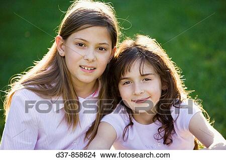 Picture - Portrait of two girls smiling. Fotosearch