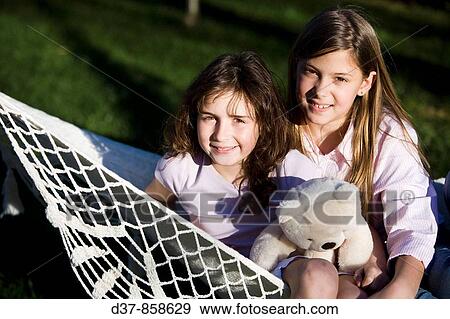 Portrait of two girls smiling View Large Photo Image Stock Photo - Portrait of two girls smiling. Fotosearch