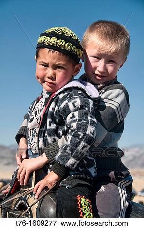 Stock Photo - portrait of two Kazakh boys in the Altai Region of Bayan-? lgii in Western Mongolia. Fotosearch