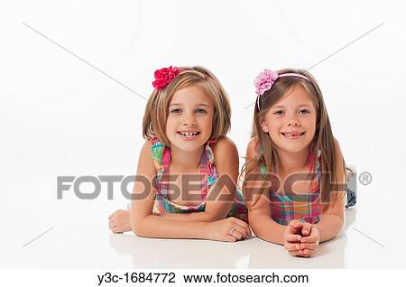Stock Image - Portrait of two sisters. Fotosearch