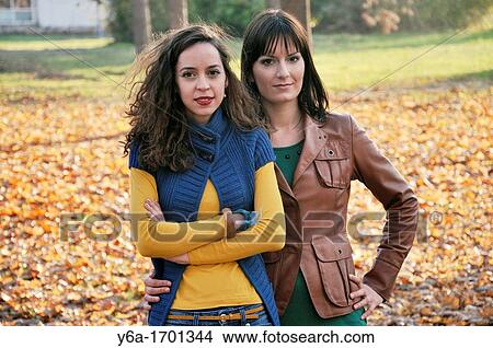 Portrait of two young women outdoors View Large Photo Image Picture - Portrait of two young women outdoors. Fotosearch