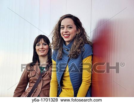 Stock Photo - Portrait of two young women outdoors. Fotosearch
