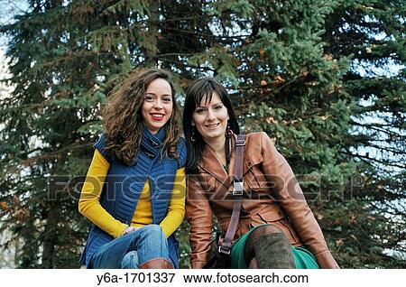 Stock Photo - Portrait of two young women outdoors. Fotosearch