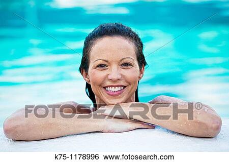 Portrait of woman in a swimming pool View Large Photo Image Stock Photograph - Portrait of woman in a swimming pool. Fotosearch