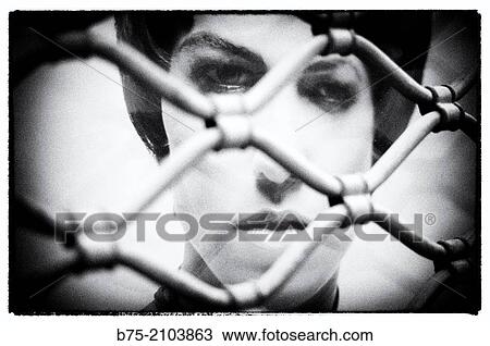 Portrait of woman in an ad seen from behind bars of a trade. View Large Photo Image Stock Image - Portrait of woman in an ad seen from behind bars of a trade.. Fotosearch
