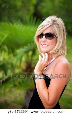 Portrait of woman in her fourties View Large Photo Image Picture - Portrait of woman in her fourties. Fotosearch