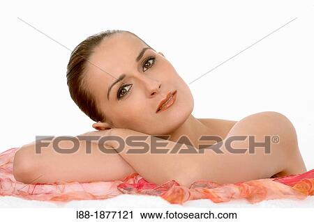 Stock Image - Portrait of woman, studio shot. Fotosearch