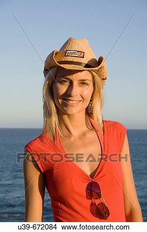 Portrait of woman wearing a cowboy hat. By the ocean, Sydney. Australia View Large Photo Image Picture - Portrait of woman wearing a cowboy hat. By the ocean, Sydney. Australia. Fotosearch