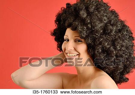 Portrait of woman wearing a wig View Large Photo Image Stock Image - Portrait of woman wearing a wig. Fotosearch