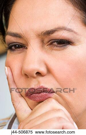 Portrait of woman with hand on face View Large Photo Image Stock Photography - Portrait of woman with hand on face. Fotosearch