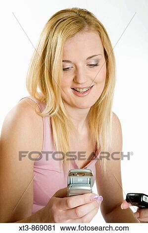Stock Image - portrait of woman with mobile phone. Fotosearch