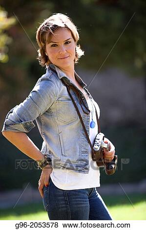 Portrait of woman with old camera taking pictures. View Large Photo Image Stock Photo - Portrait of woman with old camera taking pictures.. Fotosearch
