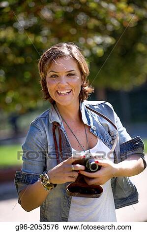 Portrait of woman with old camera taking pictures. View Large Photo Image Stock Photograph - Portrait of woman with old camera taking pictures.. Fotosearch