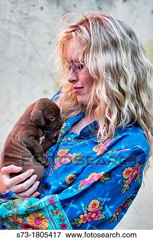 Portrait of woman with small dog View Large Photo Image Stock Photo - Portrait of woman with small dog. Fotosearch