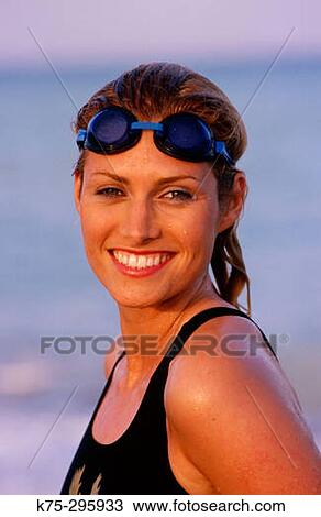 Stock Image - portrait of woman with swim goggles. Fotosearch