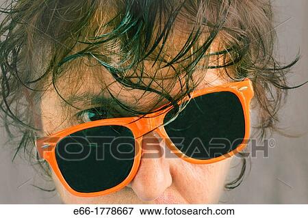 portrait of woman with wet hair and tilted orange sunglasses Processed with InstaGram look with soft grey background View Large Photo Image Stock Photo - portrait of woman with wet hair and tilted orange sunglasses Processed with InstaGram look with soft grey background. Fotosearch
