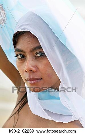 Portrait of young asian woman playing with a white tissue, Bali, Indonesia, Southeast Asia. View Large Photo Image Stock Photo - Portrait of young asian woman playing with a white tissue, Bali, Indonesia, Southeast Asia.. Fotosearch