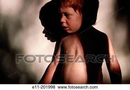 Stock Photo - Portrait of young boy. Fotosearch