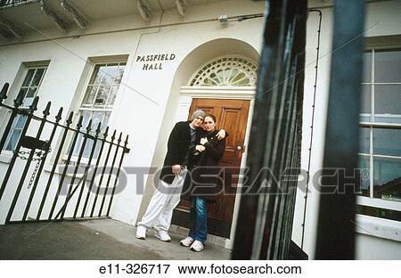 Portrait of young couple outside college apartment View Large Photo Image Stock Photo - Portrait of young couple outside college apartment. Fotosearch