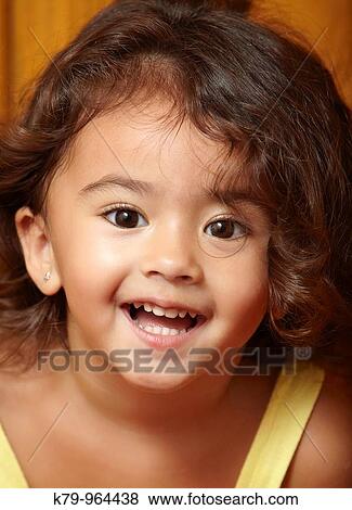 Portrait of young girl smiling View Large Photo Image Stock Photo - Portrait of young girl smiling. Fotosearch