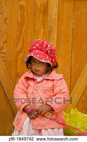 Portrait of young girl with traditional dress in small town of Pisaq Peru South America View Large Photo Image Stock Image - Portrait of young girl with traditional dress in small town of Pisaq Peru South America. Fotosearch