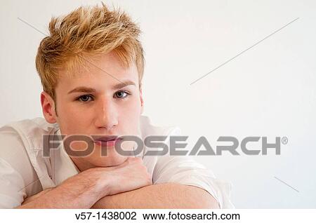 Portrait of young man looking at the camera. Close view. View Large Photo Image Stock Image - Portrait of young man looking at the camera. Close view.. Fotosearch