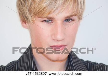 Portrait of young man looking at the camera. Close view. View Large Photo Image Stock Photo - Portrait of young man looking at the camera. Close view.. Fotosearch