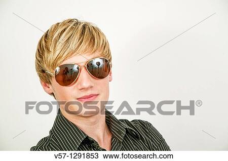 Portrait of young man wearing sunglasses. Close view. View Large Photo Image Stock Image - Portrait of young man wearing sunglasses. Close view.. Fotosearch