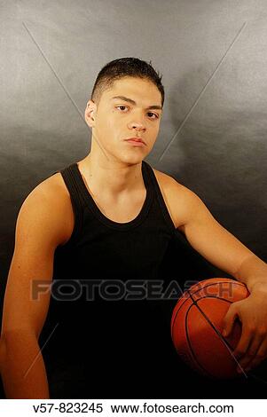 Portrait of young man with basketball, looking at the camera View Large Photo Image Stock Photography - Portrait of young man with basketball, looking at the camera. Fotosearch