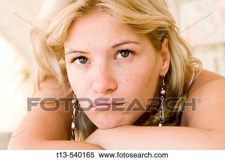 Portrait of young unhappy girl with puckering lips View Large Photo Image Stock Photography - Portrait of young unhappy girl with puckering lips. Fotosearch
