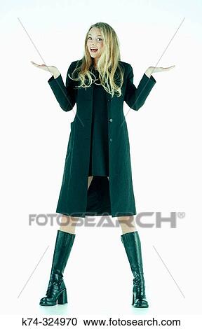 Stock Image - Portrait of Young Woman Gesturing To Camera. Fotosearch