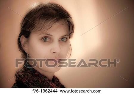 Portrait of young woman in mid twenties View Large Photo Image Picture - Portrait of young woman in mid twenties. Fotosearch