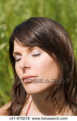 Portrait of young woman in the countryside View Large Photo Image Stock Photo - Portrait of young woman in the countryside. Fotosearch
