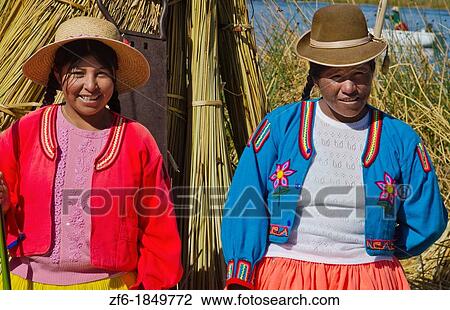 Portrait of young woman in Uros family on floating islands of Lake Titicaca in Puno Peru View Large Photo Image Stock Image - Portrait of young woman in Uros family on floating islands of Lake Titicaca in Puno Peru. Fotosearch