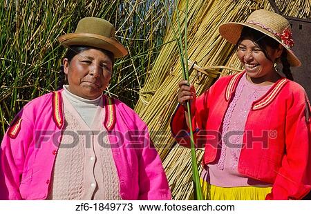 Portrait of young woman in Uros family on floating islands of Lake Titicaca in Puno Peru View Large Photo Image Stock Image - Portrait of young woman in Uros family on floating islands of Lake Titicaca in Puno Peru. Fotosearch