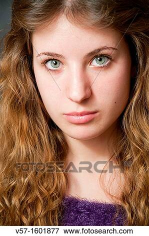 Portrait of young woman looking at the camera. Close view. View Large Photo Image Stock Photo - Portrait of young woman looking at the camera. Close view.. Fotosearch