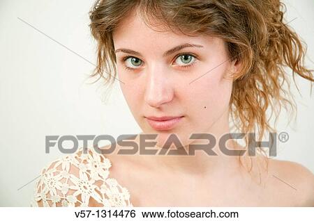 Portrait of young woman looking at the camera. Close view. View Large Photo Image Stock Photograph - Portrait of young woman looking at the camera. Close view.. Fotosearch