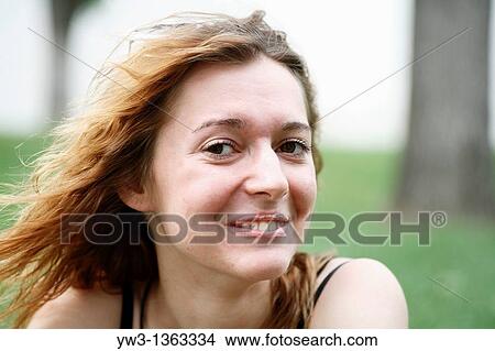 Picture - Portrait of young woman outdoors. Fotosearch