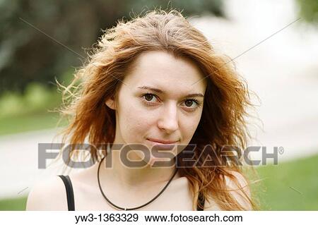 Portrait of young woman outdoors View Large Photo Image Stock Photo - Portrait of young woman outdoors. Fotosearch
