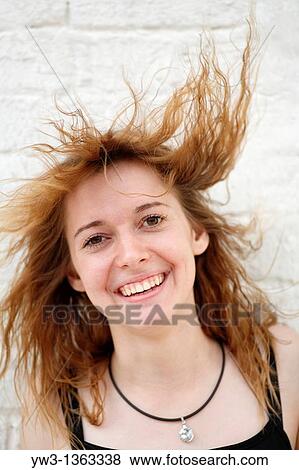 Stock Photo - Portrait of young woman outdoors. Fotosearch